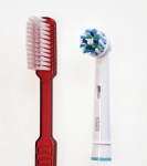 Figure 1 The study test products: novel oscillating-rotating brush head with angled bristle tufts (right) and flat-trim manual toothbrush (left).